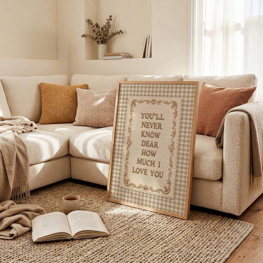 Beige gingham love quote poster framed beside a soft sofa and reading nook