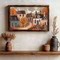 Autumn village canvas poster with pumpkins, cottages, and orange foliage