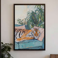 Black framed tiger painting on a white wall with teal sofa and tropical plants