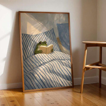 Green frog reading a beige book in blue striped bed artwork