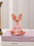 This adorable sculpture is perfect for those looking to add a touch of charm and style to their home decor. Made with high-quality materials, this Sphynx cat sculpture is not only aesthetically pleasing but also durable. Its unique design will surely impress any cat lover and add character to any space.