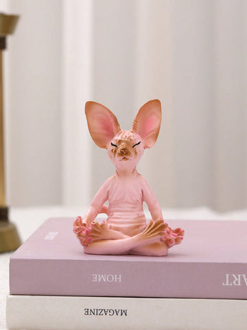 This adorable sculpture is perfect for those looking to add a touch of charm and style to their home decor. Made with high-quality materials, this Sphynx cat sculpture is not only aesthetically pleasing but also durable. Its unique design will surely impress any cat lover and add character to any space.