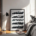 Black framed SPEED race car artwork beside a sunlit bedroom
