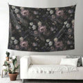 Dark vintage floral tapestry displayed above white sofa in living room