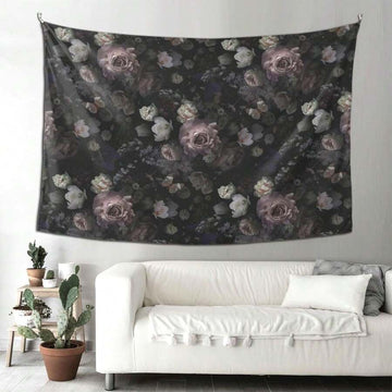 Dark vintage floral tapestry displayed above white sofa in living room