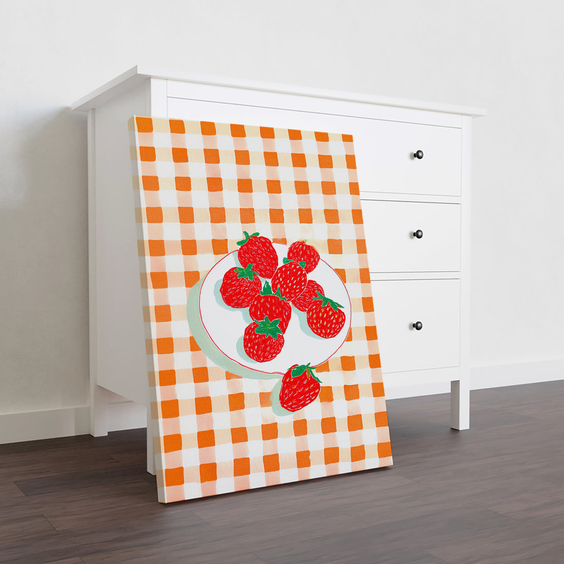 Enhance your living space with this decorative kitchen wall art canvas featuring a charming strawberry design set against a vibrant orange gingham pattern. Perfect for adding a fresh, inviting touch to your kitchen, living room, or bedside area, this piece blends classic motifs with contemporary style to complement various decor themes. Its vivid colors and detailed artwork create a warm ambiance, making it an ideal backdrop for sofas or beds while elevating your home's overall aesthetic.
