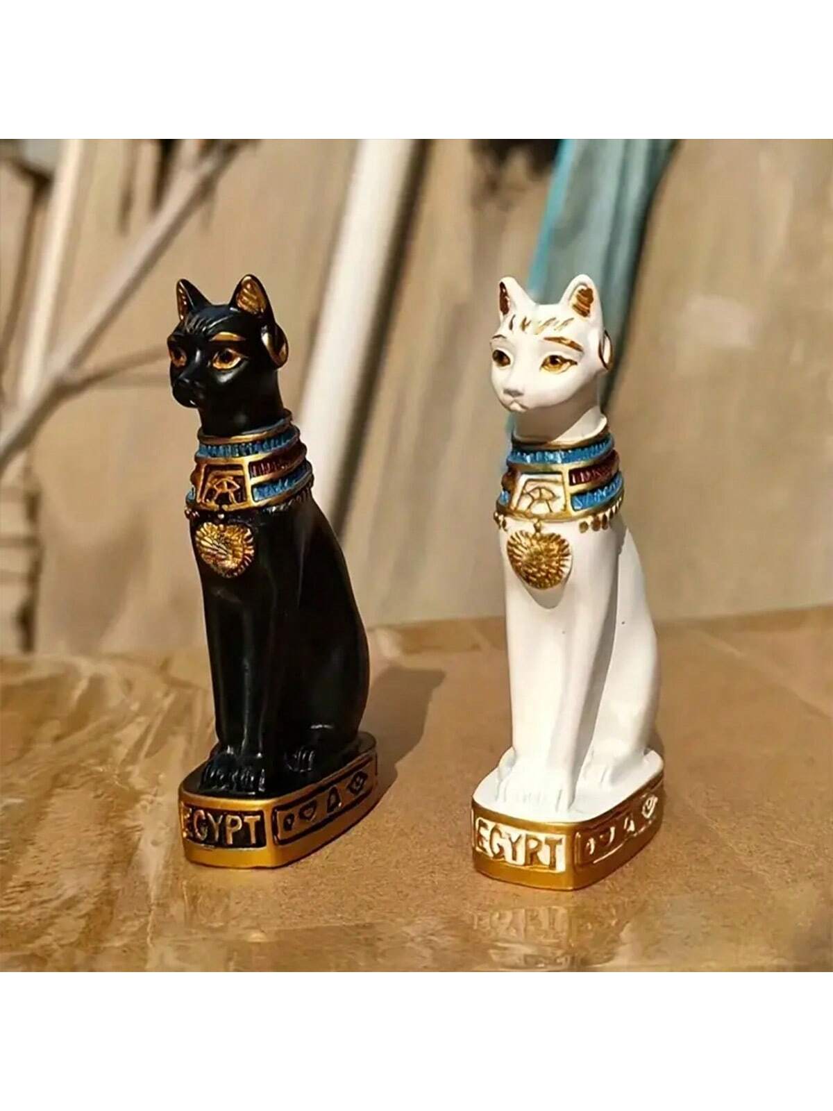 Discover the timeless charm of our Egyptian Cat Statue. Perfect for both indoor and outdoor spaces, this decorative piece adds a touch of ancient elegance to any setting. Crafted with intricate details, it's a must-have for cat lovers and history enthusiasts alike.