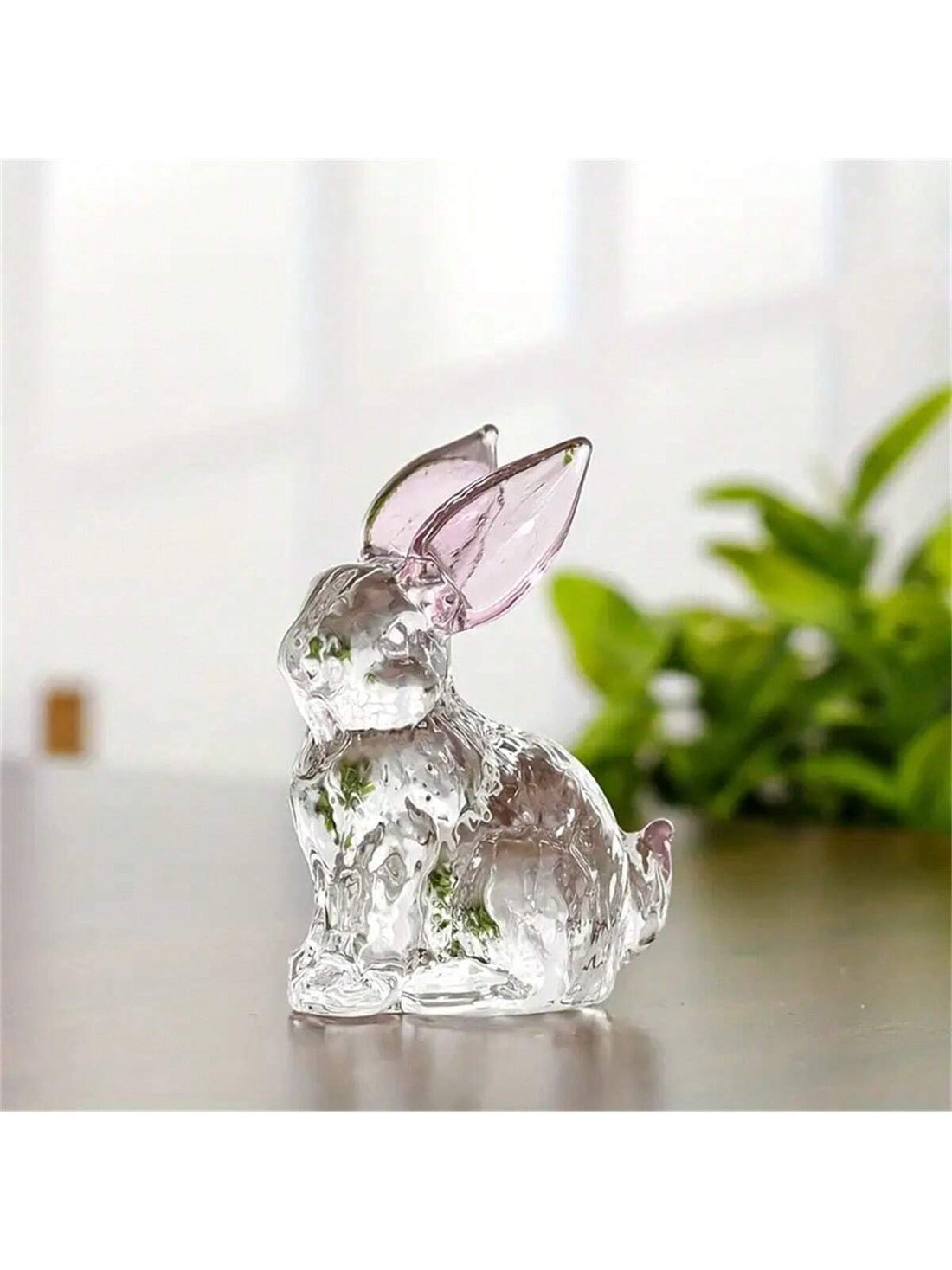 Add a touch of elegance to your home with our Crystal Rabbit Ornament. This adorable transparent bunny décor is perfect for displaying in your home or giving as a thoughtful teacher appreciation gift. Made of high-quality crystal, this ornament is sure to add a touch of sophistication to any space.