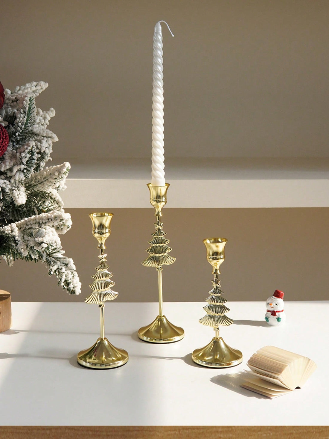 Transform your holiday décor with this sophisticated 3-piece candle holder set, featuring intricate snowflake designs in lustrous gold finish. Each holder combines timeless elegance with versatile functionality, perfect for creating ambient lighting in any setting—from intimate home gatherings to upscale restaurant displays. The refined craftsmanship and seasonal aesthetic make these holders an essential accent for festive tablescapes and year-round entertaining.