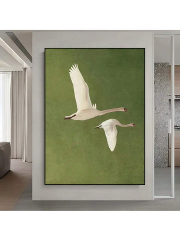 Enhance your living or office space with this elegant hand-painted canvas art featuring two flying swans. The detailed brushwork captures the grace and movement of these birds, bringing a serene and sophisticated atmosphere to your walls. Crafted for modern interiors, this artwork serves as a timeless focal point, blending seamlessly with contemporary decor while adding a touch of natural beauty and tranquility.