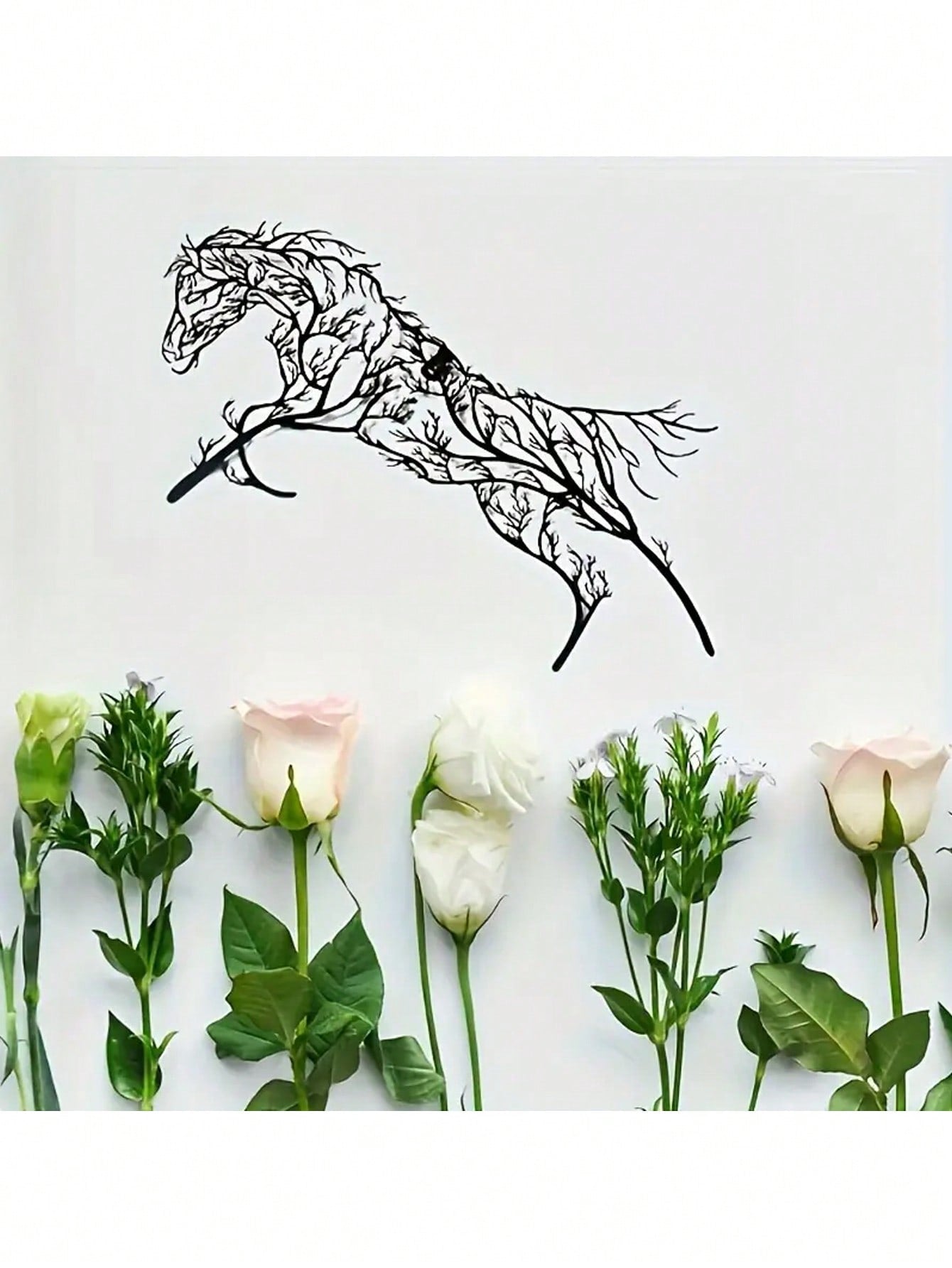 Add an elegant touch to your home or outdoor space with our Elegant Iron Horse Branch Wall Art. Made with stylish metal silhouettes, this piece will add a unique and sophisticated look to any room. Perfect for horse lovers and those looking for a stylish decor piece.