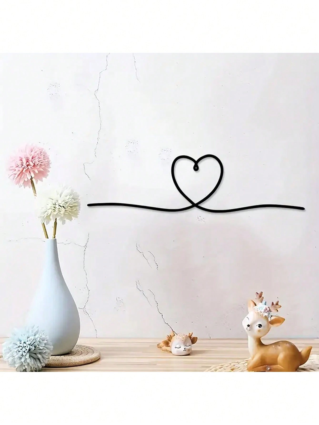 Bring a touch of love and modern style to your space with our Elegant Metal Heart Line Art. Its stylish design and durable metal material make it the perfect addition to any wall. Its minimalistic yet elegant look will bring a sense of sophistication to your home or office.