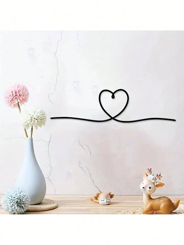 Bring a touch of love and modern style to your space with our Elegant Metal Heart Line Art. Its stylish design and durable metal material make it the perfect addition to any wall. Its minimalistic yet elegant look will bring a sense of sophistication to your home or office.