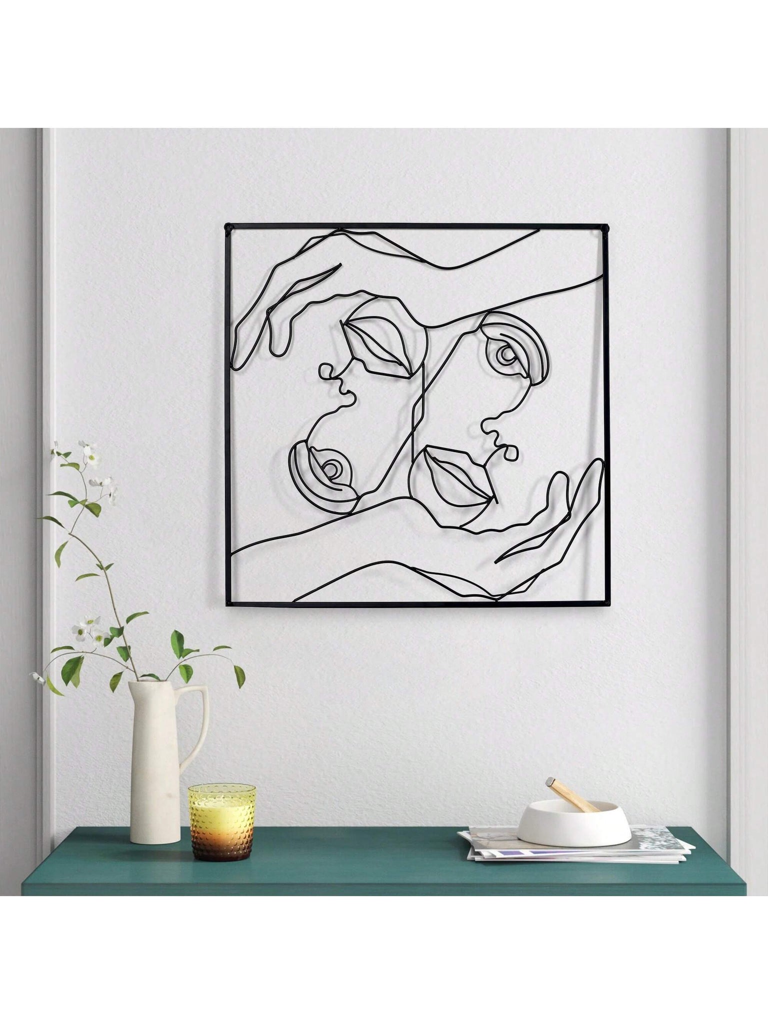 Enhance the aesthetic of your home with our Elegant Minimalist Female Silhouette Metal Wall Sculpture. Measuring 26" x 26", this exquisite piece of art is perfect for adorning your kitchen, bedroom, or living room. Its sleek design and high-quality craftsmanship will elevate any space.