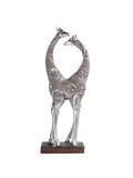 This elegant silver giraffe lovers figurine is a perfect addition to any couple's home. The romantic wildlife design adds a touch of love and harmony to any room. Expertly crafted with exquisite detail, this figurine is a beautiful representation of the bond between couples. A must-have for any decor!