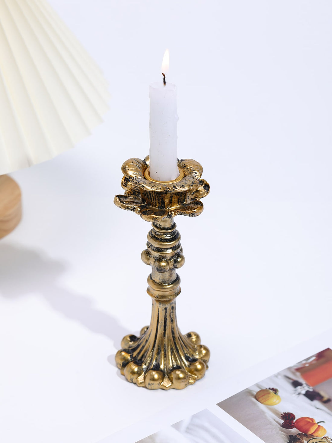 This elegant vintage-inspired candle holder adds a timeless touch to any home décor. Crafted with intricate details and exquisite craftsmanship, it brings a touch of sophistication to any room. The perfect accent piece for creating a warm and inviting atmosphere, it is a must-have for any candle lover.