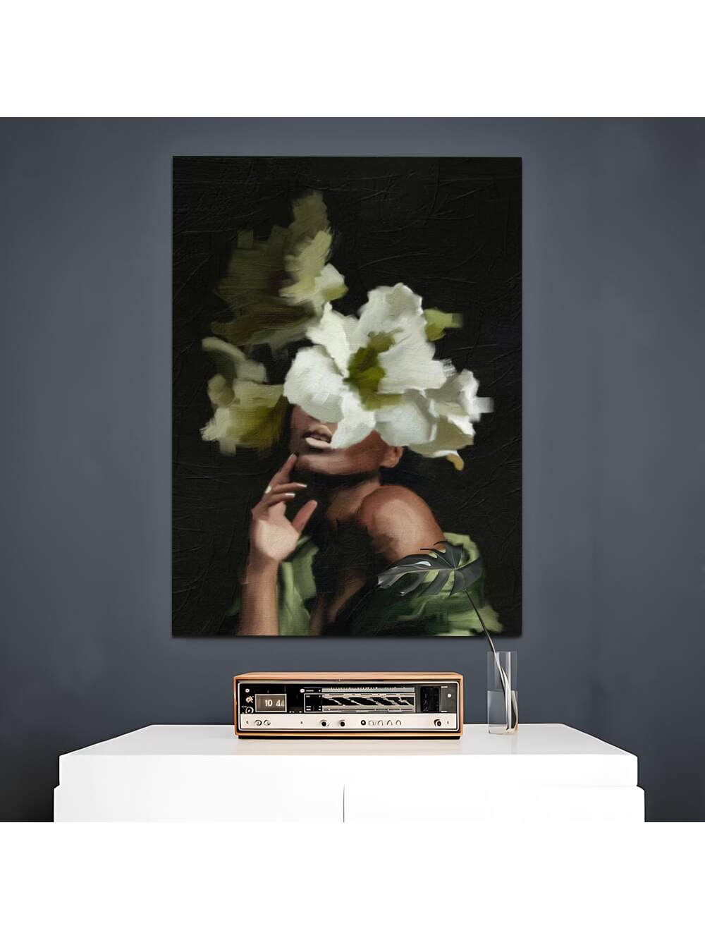 This framed canvas art features a modern African American woman surrounded by flowers, adding elegance to any living space. Made with superior materials, this piece is a beautiful addition to your home. Embrace sophistication and grace with this stunning artwork.