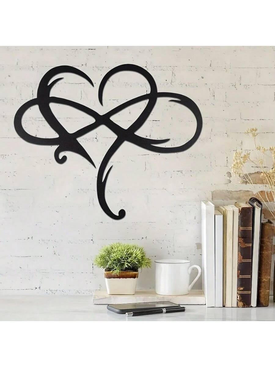 Introduce timeless elegance to any space with our Endless Love: Black Infinity Heart Metal Wall Decor. Made with durable metal, this eye-catching piece features a sleek, black infinity heart design that symbolizes everlasting love. Perfect for adding a touch of sophistication and sentimentality to your home.