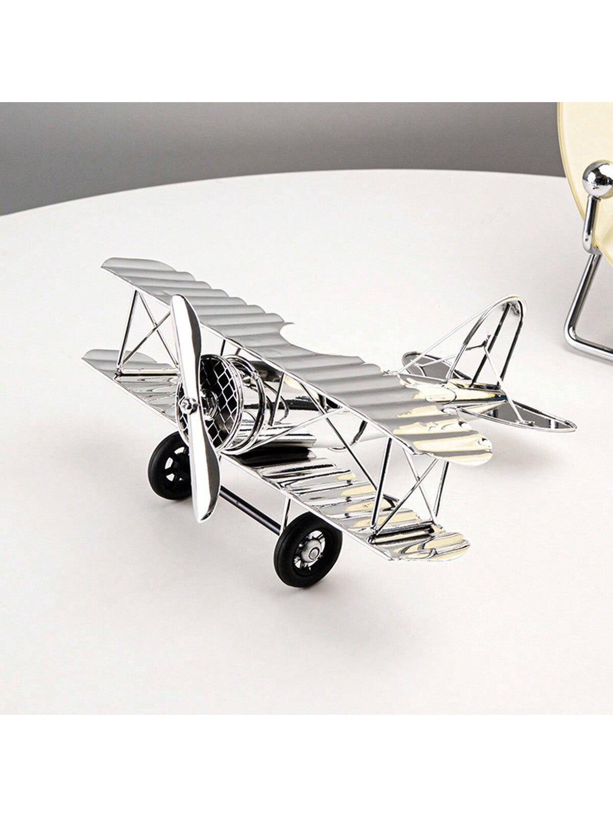 Elevate your home decor with our European Style Light Luxury Silver Airplane Model Ornament. This unique piece adds a touch of creativity and sophistication to any room. Crafted with meticulous attention to detail, it is sure to impress guests and bring a touch of elegance to your space.