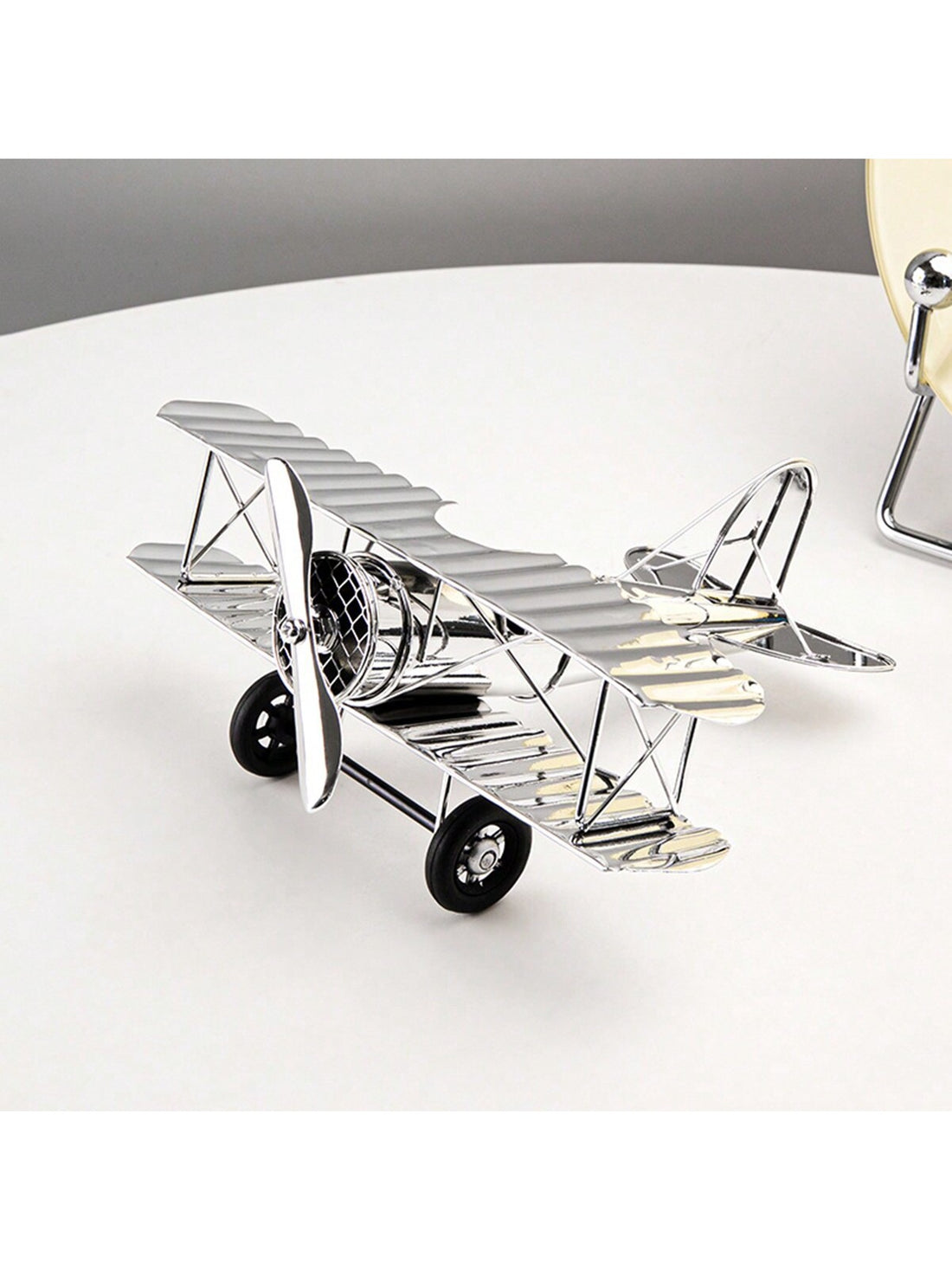 Elevate your home decor with our European Style Light Luxury Silver Airplane Model Ornament. This unique piece adds a touch of creativity and sophistication to any room. Crafted with meticulous attention to detail, it is sure to impress guests and bring a touch of elegance to your space.