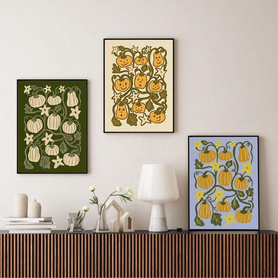 Fall pumpkin and jack-o-lantern poster trio on console