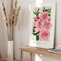 Framed pink azalea botanical print with green leaves and FLEURS D’ ETE AZALEE ROSE text on a console