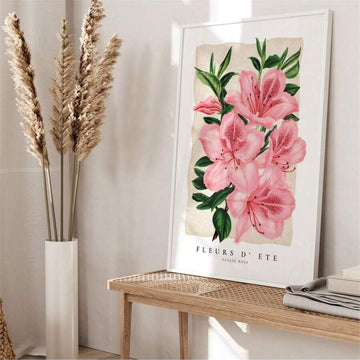 Framed pink azalea botanical print with green leaves and FLEURS D’ ETE AZALEE ROSE text on a console