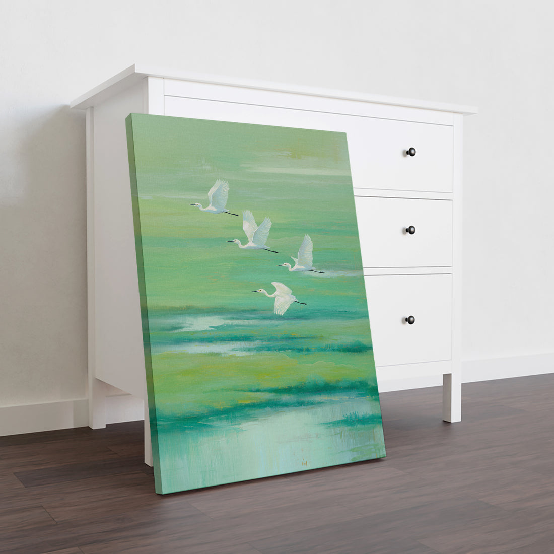 Elevate your interior with this striking canvas wall art featuring graceful flying cranes rendered in soothing green and turquoise hues. The abstract nature composition brings movement and tranquility to any space, making it an ideal focal point above your sofa, bed, or living room wall.