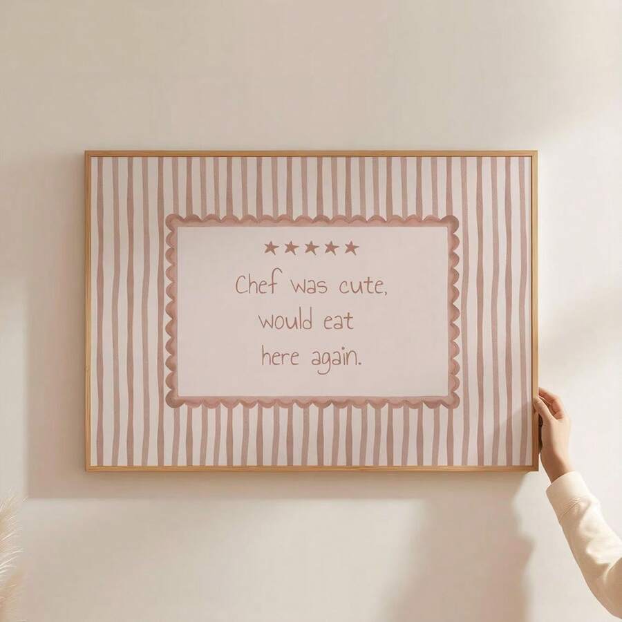 Add playful personality to your kitchen or dining space with this funny kitchen wall art featuring the cheerful message “Chef Was Cute, Would Eat Here Again.” The blush pink and cream striped design, scalloped border, five-star detail, and warm wooden frame create a charming retro café feel that is easy to enjoy every day.