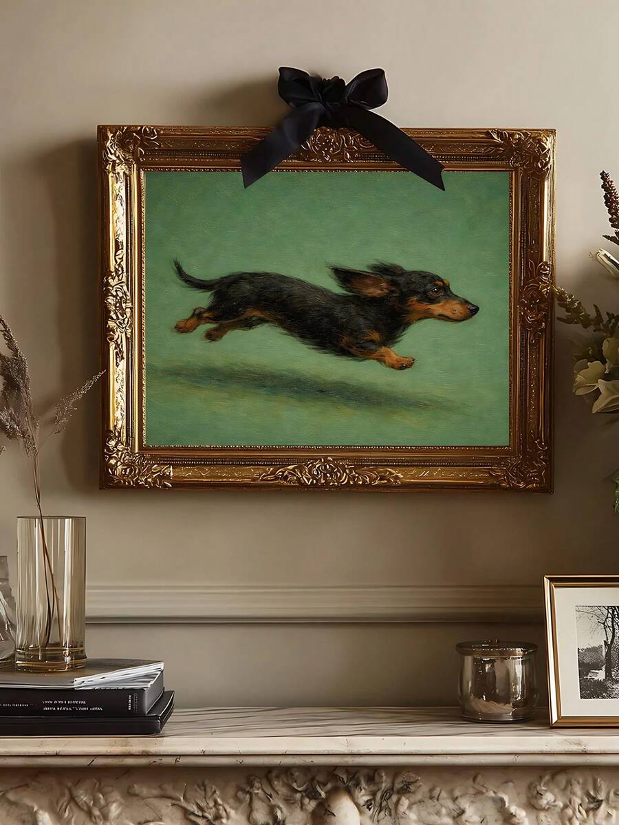 Framed dachshund wall art with ornate gold frame and black bow above mantel