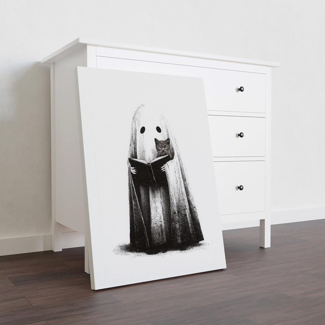Elevate your home decor with this expert-crafted black and white Halloween canvas print featuring a ghost reading alongside a curious cat. Perfect for living rooms, sofa backdrops, or bedside decoration, this artwork adds a subtle yet sophisticated seasonal touch. Its monochrome palette ensures seamless integration with various interior styles, creating a captivating focal point that blends festive charm with timeless elegance.