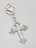 Elevate your accessories game with our glamorous floral cross keychain. Made from high-quality materials, this keychain adds a touch of elegance to any outfit. With its intricate design and durable construction, it's the perfect way to keep your keys organized while making a stylish statement.