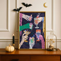 Gothic Halloween cocktail artwork framed beside a pumpkin, candle, bats, and skull