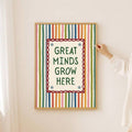 Striped Great Minds Grow Here classroom canvas poster displayed on a light wall