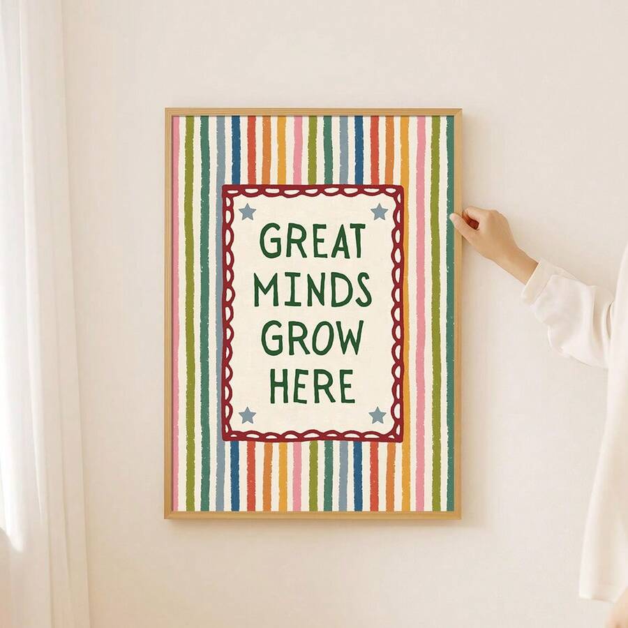 Striped Great Minds Grow Here classroom canvas poster displayed on a light wall