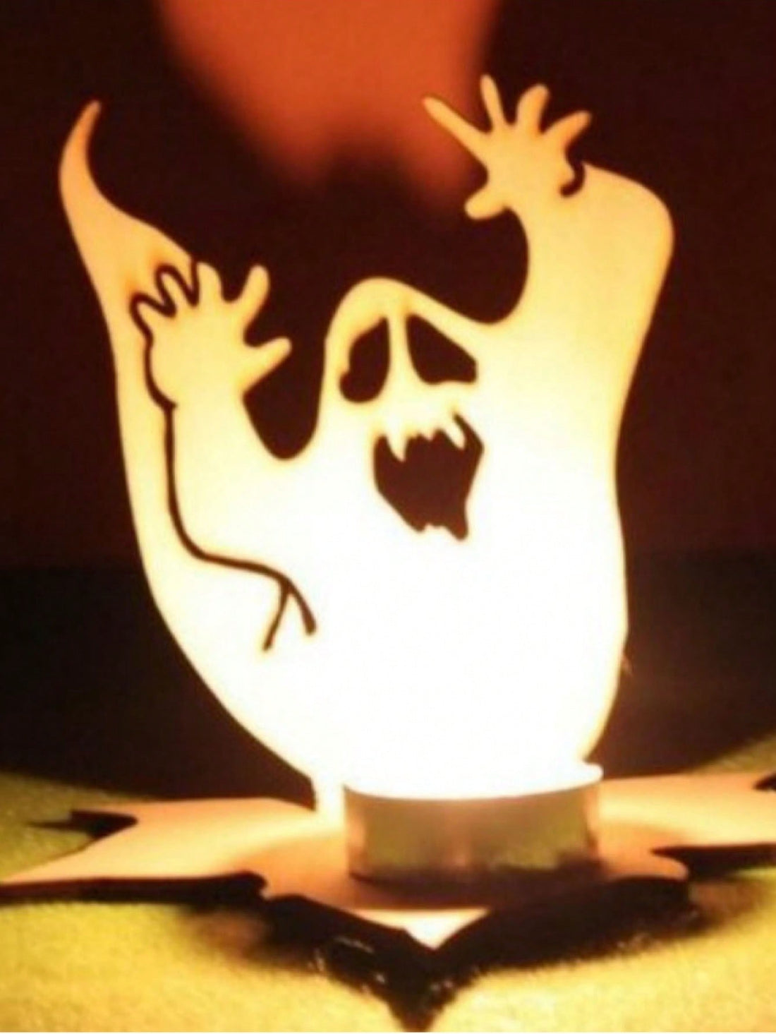 Create a spooky atmosphere for your Halloween party with our Ghost Candle Projection! This unique decoration projects a haunting image of a ghost onto any surface, perfect for creating a horror-inspired ambiance. Add an extra touch of fear to your home with our Spooky Halloween Ghost Candle Projection.