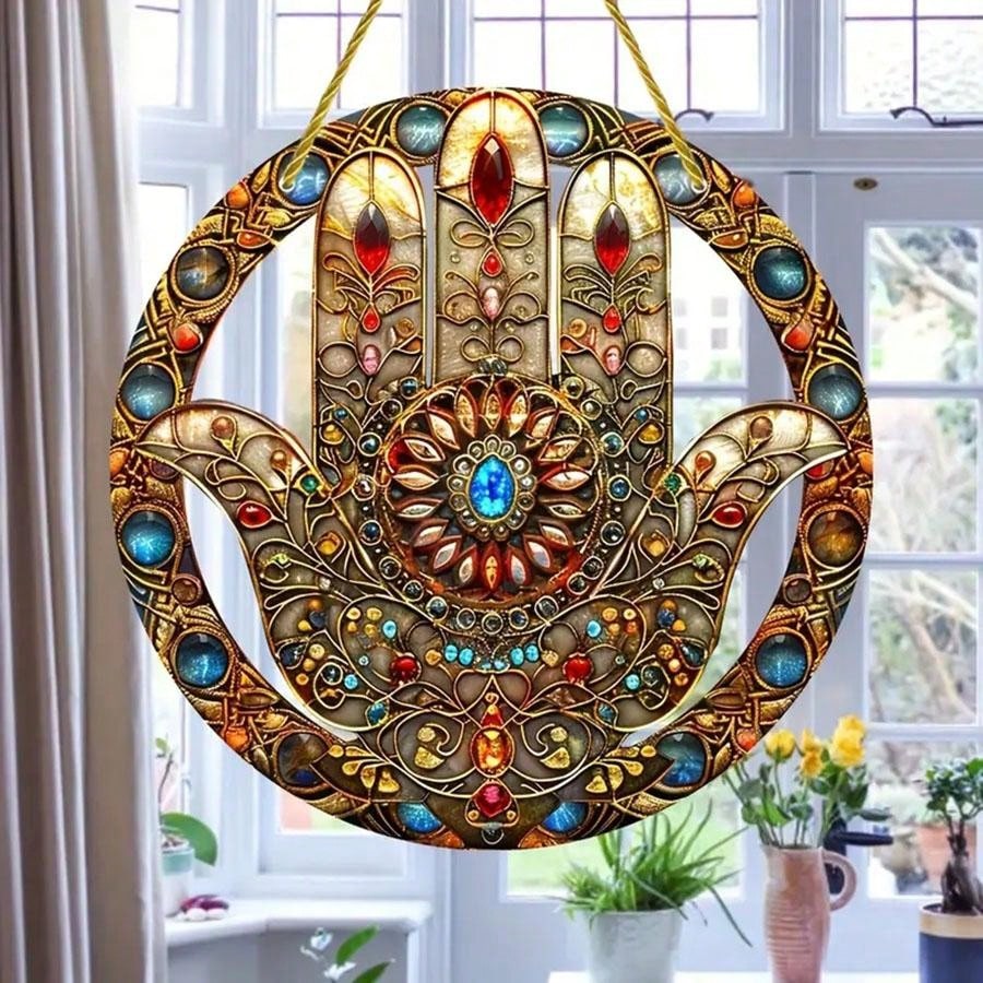 Enhance the ambiance of your home and garden with our versatile Hamsa Hand Suncatcher. Crafted from durable acrylic, this boho-inspired wall decor brings a touch of style and protection to any space. Perfect for indoor or outdoor use, it adds a unique flair while inviting positive energy into your surroundings.