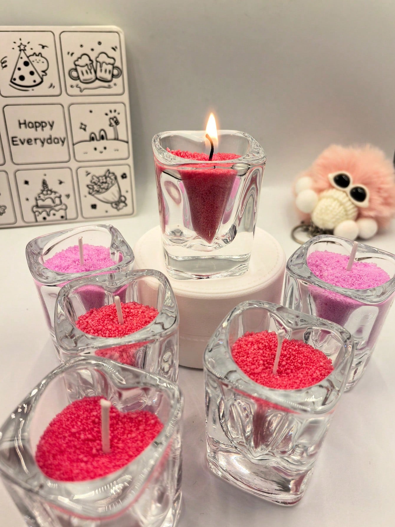 Create a romantic atmosphere with the Heart-Shaped Sand Art Candle. This DIY decor is perfect for home or parties and makes a thoughtful gift for Valentine's Day. The heart shape and sand art design add a touch of elegance to any space. Crafted with love for a truly special experience.