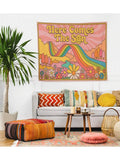 Here Comes The Sun retro rainbow tapestry above sofa in boho living room