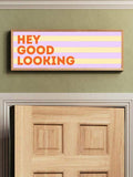 Hey Good Looking banner above wooden door