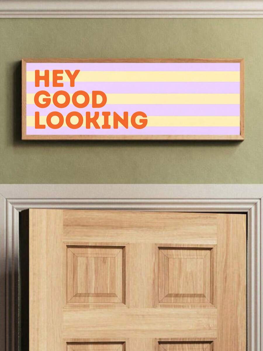 Hey Good Looking banner above wooden door