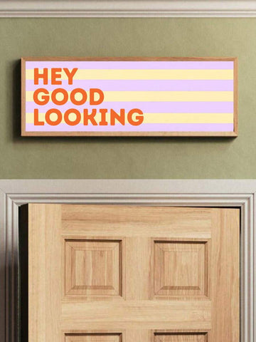 Hey Good Looking banner above wooden door
