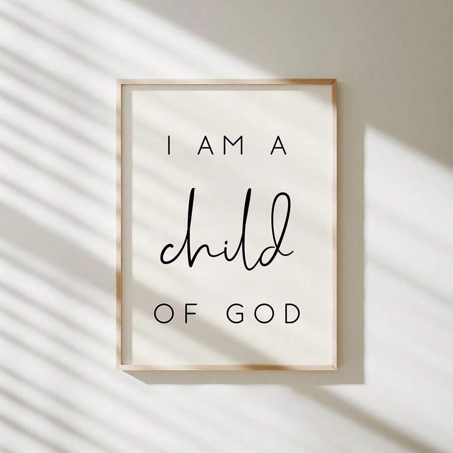 Framed I Am a Child of God print on a sunlit cream wall