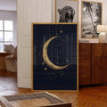 Large gold crescent and stars canvas leaning in an eclectic room with wood furniture wildlife art and tropical prints