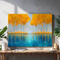 Transform your space with this striking modern abstract canvas that masterfully blends nature-inspired elements with contemporary design. The composition features a serene blue lake reflection anchored by golden forest tones, creating visual depth and sophistication. Perfect for living rooms, bedroom walls, or above sofas, this landscape painting serves as a compelling focal point that elevates any interior aesthetic. The abstract approach allows it to complement various décor styles while the warm and cool
