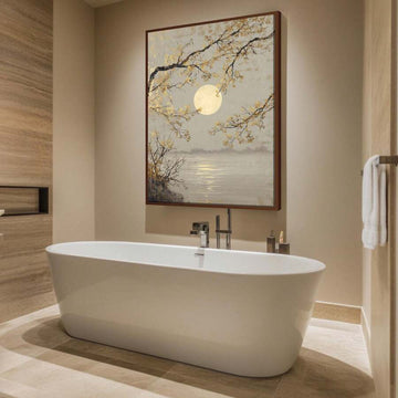Framed full moon lake landscape wall art with gold tree branches above bathtub in modern bathroom
