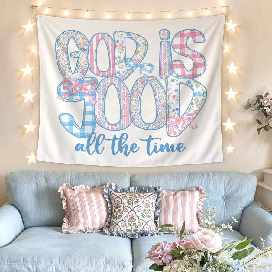 God Is Good pastel Christian tapestry displayed above a blue sofa