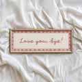 Love You Bye wall art with pink cursive lettering