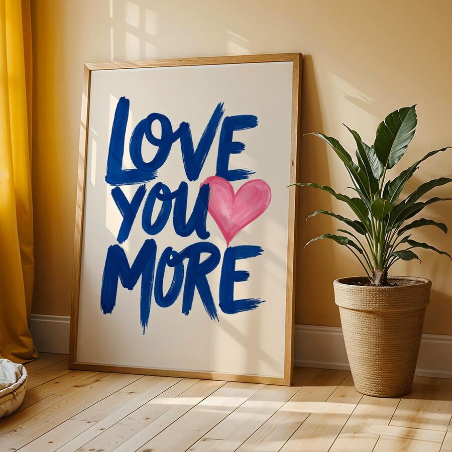 Framed Love You More blue lettering print by plant and mustard curtain