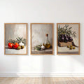Three Mediterranean vegetable still life prints in natural look frames
